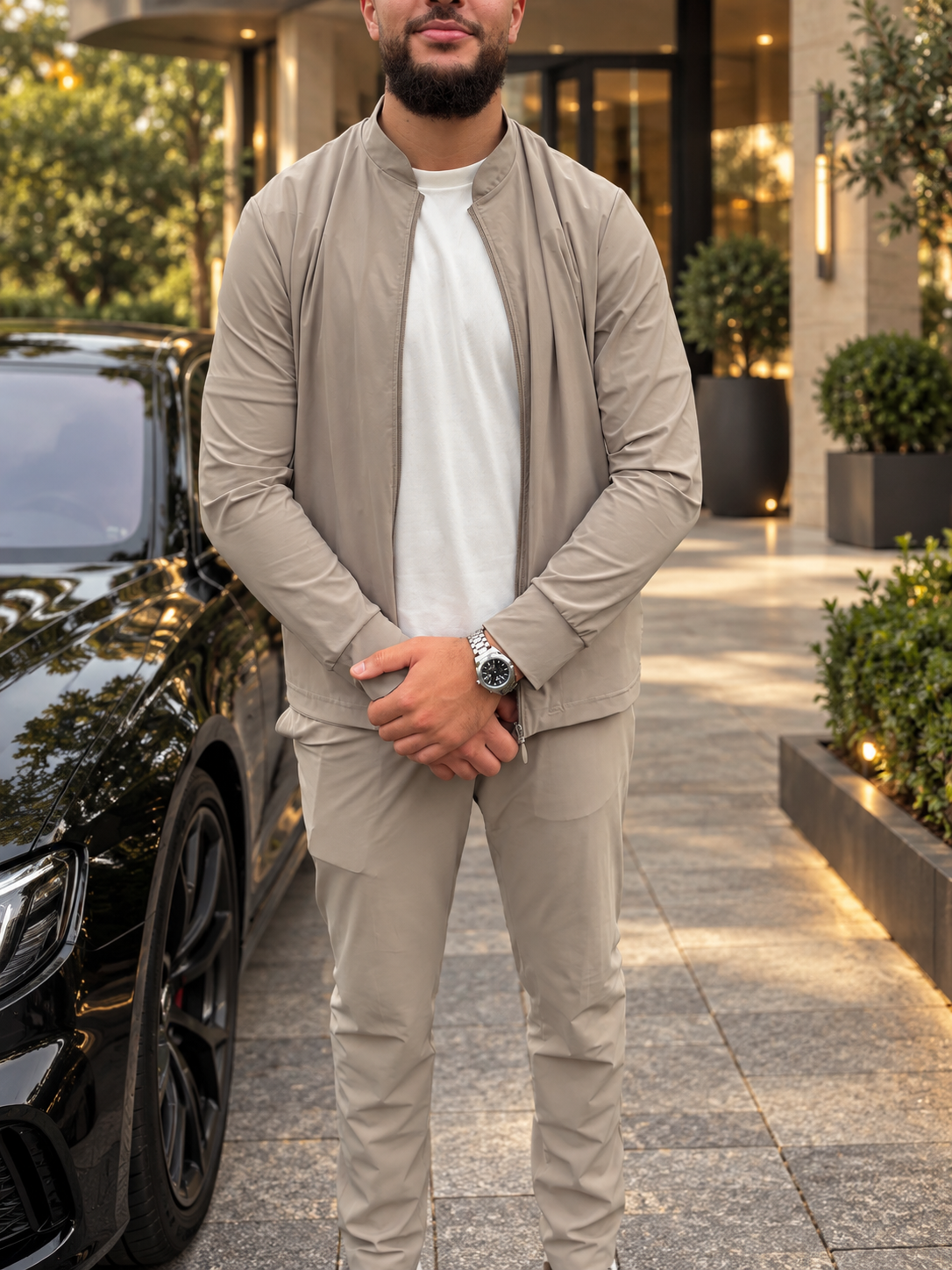 MQ Nocturne worn with a beige suit